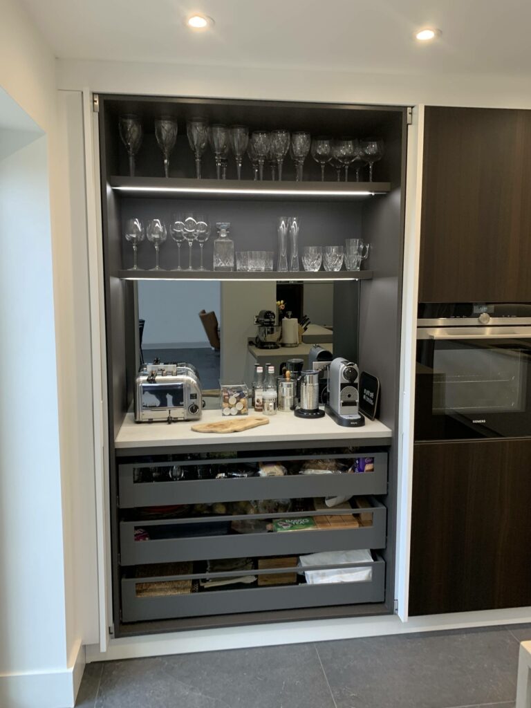 Bespoke pantry cupboard with pocket doors