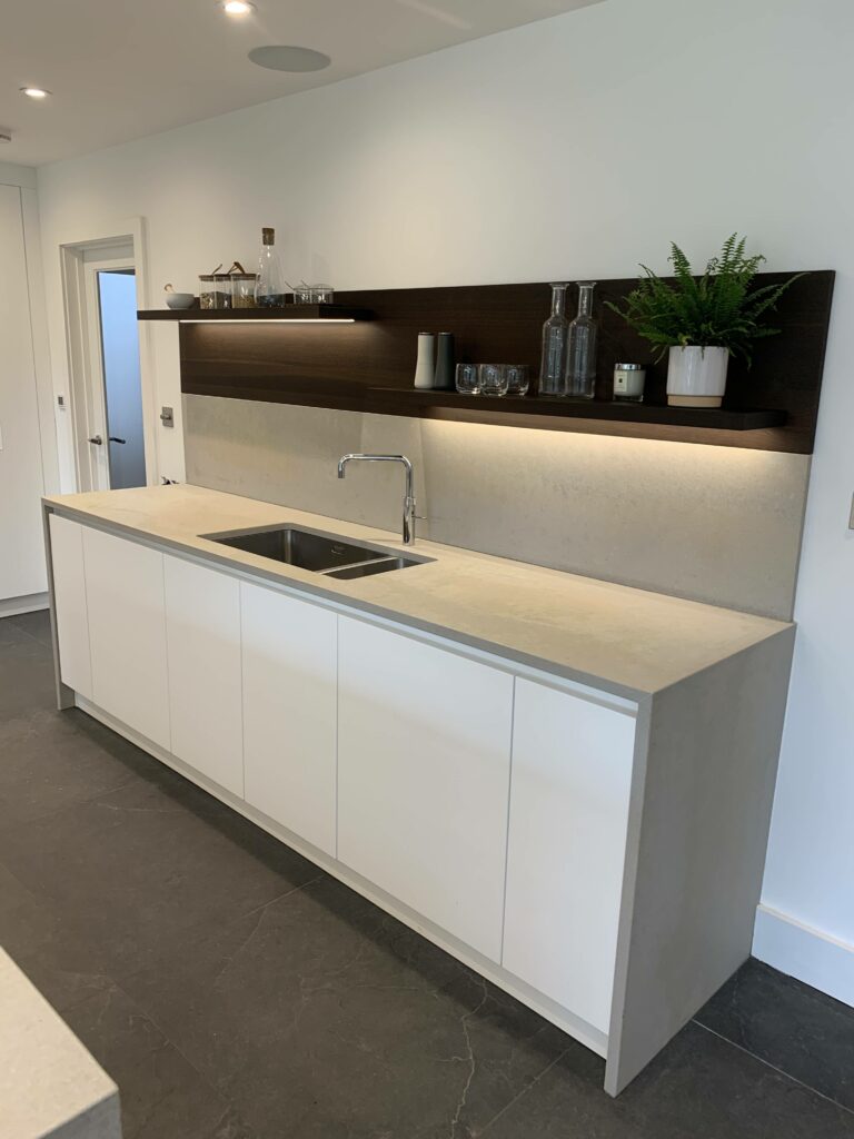 Modern kitchen floating shelves and sink with Quooker tap